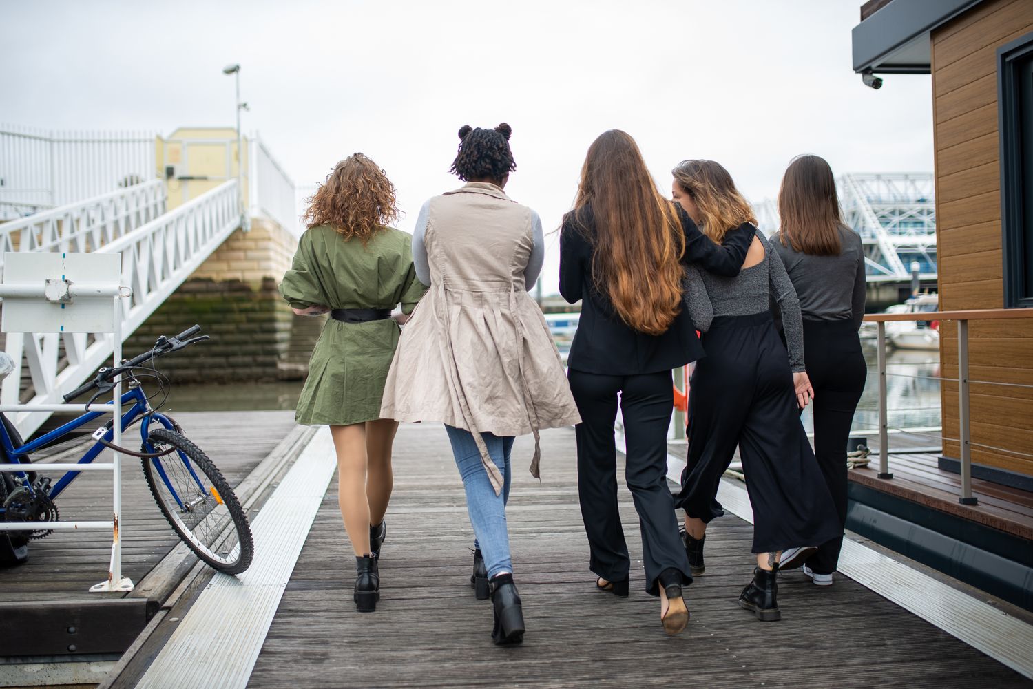 Off-duty yacht crew — a group of women walking together along a marina dock